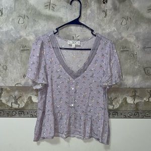 Women’s purple floral ruffled blouse. New condition. Size large. From Macys